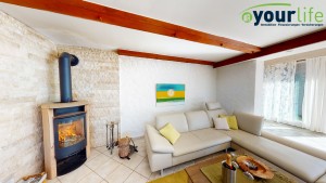 Rettenberg_Eigentumswohnung_Wohnzimmer_Kamin